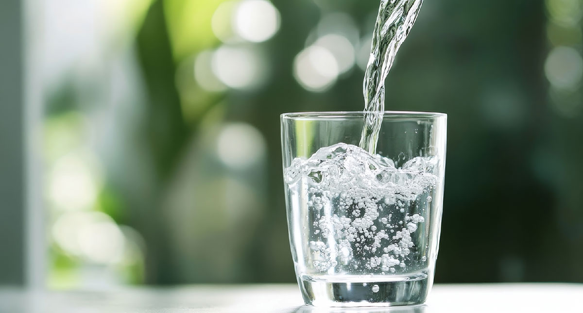 A glass of water on a wooden table